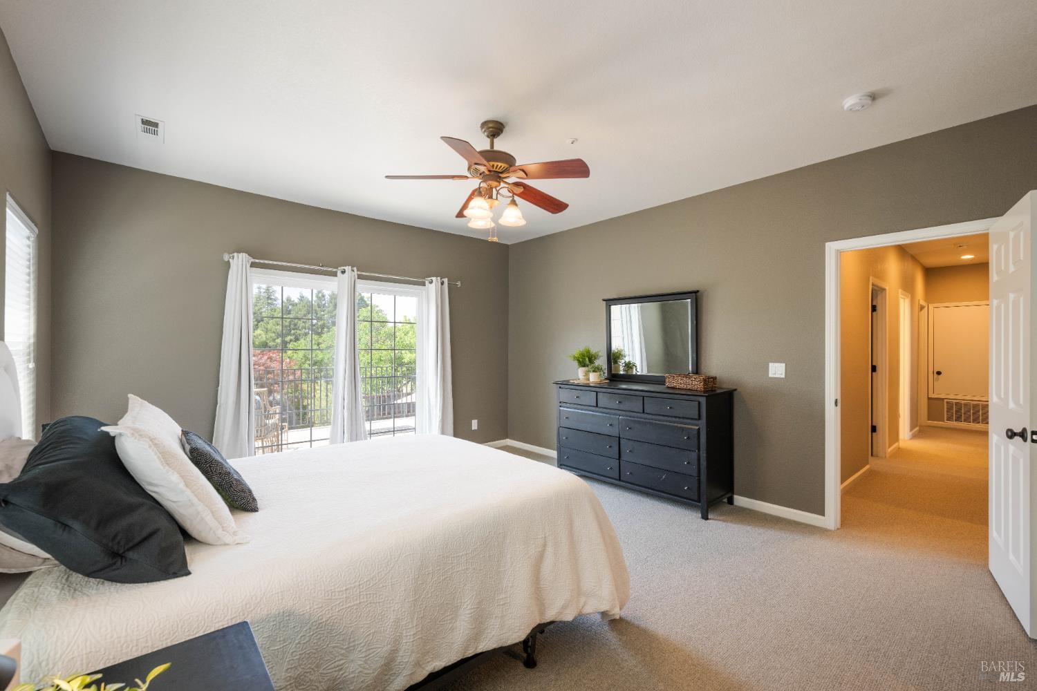 1238 Darling Street Napa, CA 94558 - Photo 49 of 68 a spacious bedroom with a bed and a chandelier