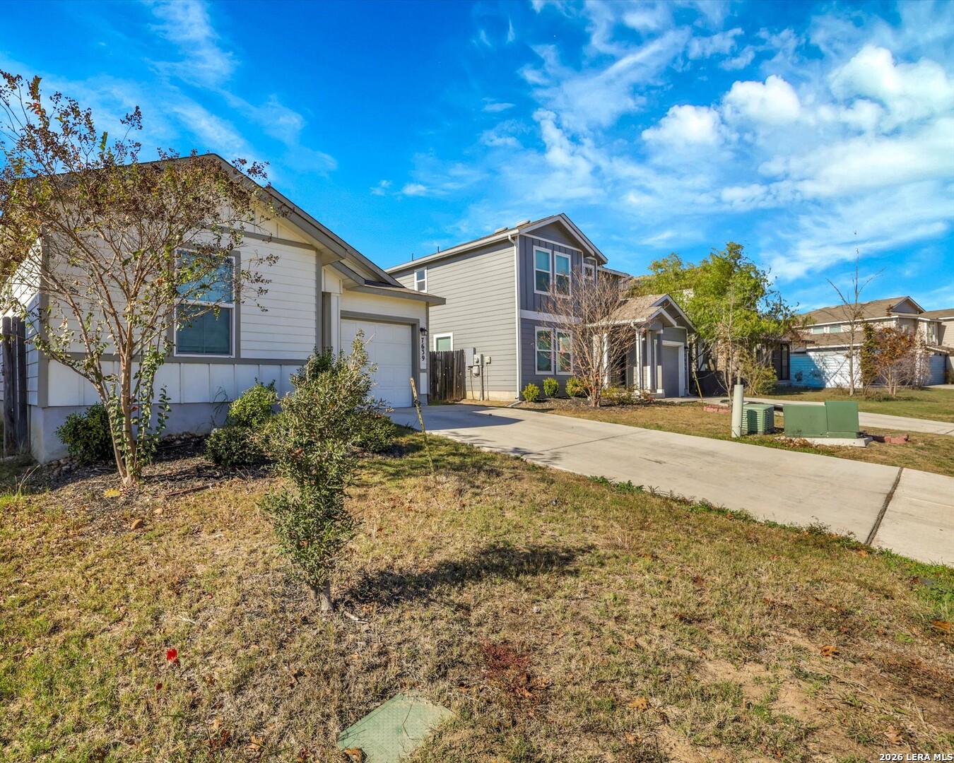 7639 Hercules Point San Antonio, TX 78252 - Photo 2 of 28 a front view of a house with a yard
