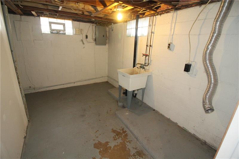 166 Francis Road Pittsburgh, PA 15239 - Photo 15 of 22 A roomy laundry room is allocated in the lower level of this house!