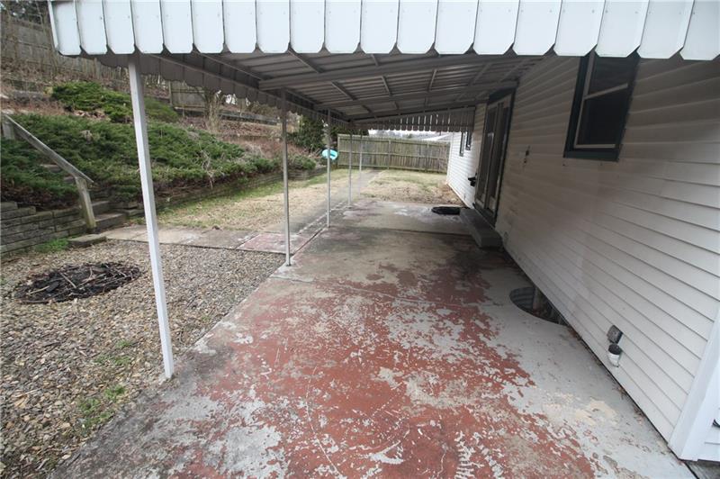 166 Francis Road Pittsburgh, PA 15239 - Photo 18 of 22 The patio off the rear of the home offers a lot of possibilities to a future home owner!
