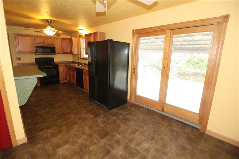 166 Francis Road Pittsburgh, PA 15239 - Photo 7 of 22 The Dining Room area is served by sliding glass doors which open up to a covered deck area! This area is also equipped with a ceiling mounted Light /fan unit!