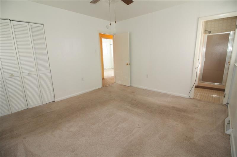 166 Francis Road Pittsburgh, PA 15239 - Photo 9 of 22 The master bedroom is serviced by a full bathroom and a ceiling mounted light/fan unit...