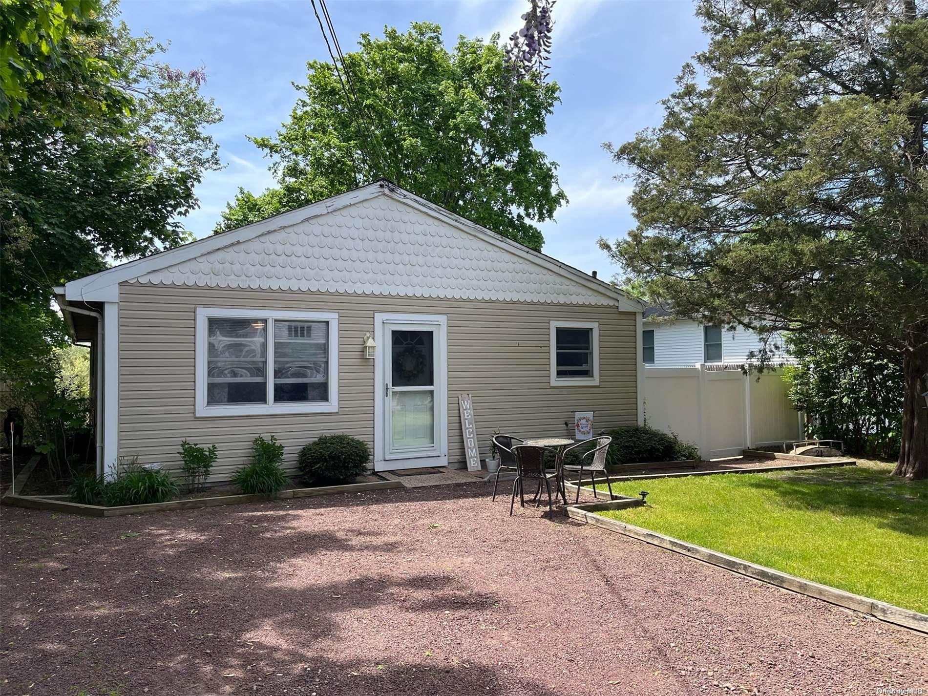 21 Laurin Road Calverton, NY 11933 - Photo 1 of 1 a view of a house with backyard and sitting area