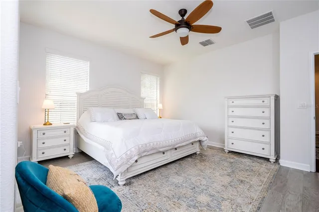 a bedroom with a bed and a dresser