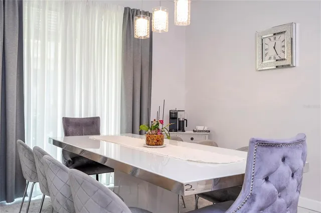 a kitchen with granite countertop stainless steel appliances wooden cabinets and a sink