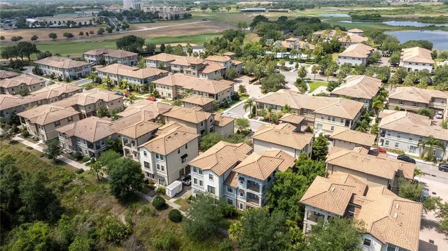an aerial view of residential houses with outdoor space