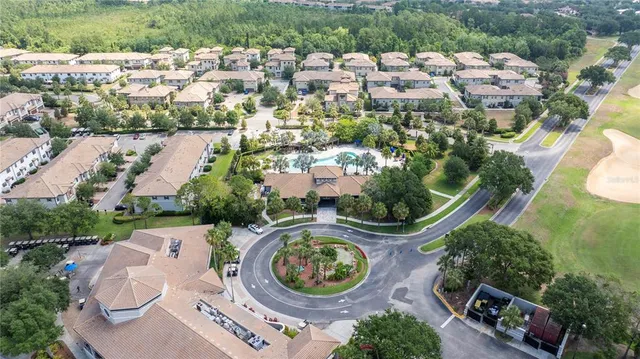 an aerial view of a house with outdoor space and lake view
