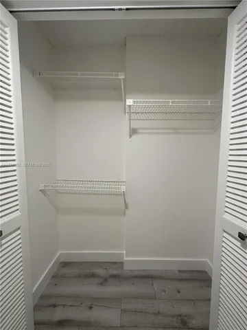 a view of swimming pool and trees in the background