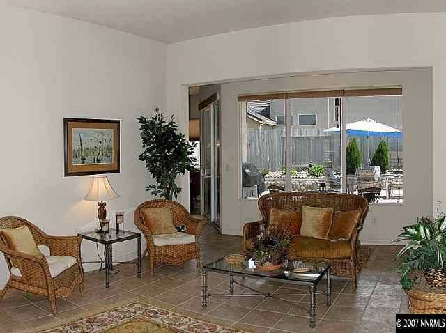 10490 Gold Arrow Drive Reno, NV 89521 - Photo 3 of 9 a living room with furniture and a potted plant