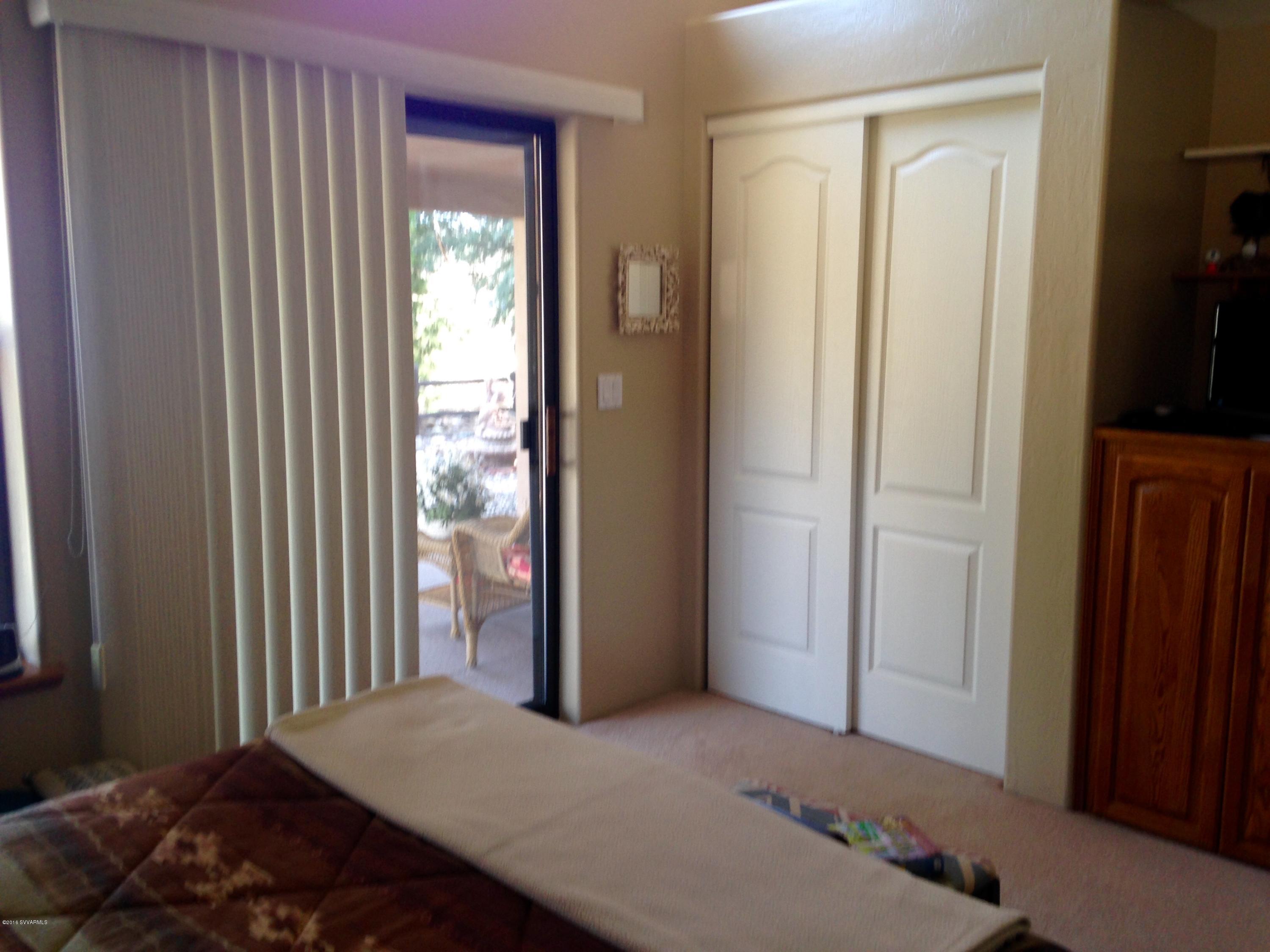 3749 East Beaver Vista Road Rimrock, AZ 86335 - Photo 24 of 26 a bedroom with a bed and a window