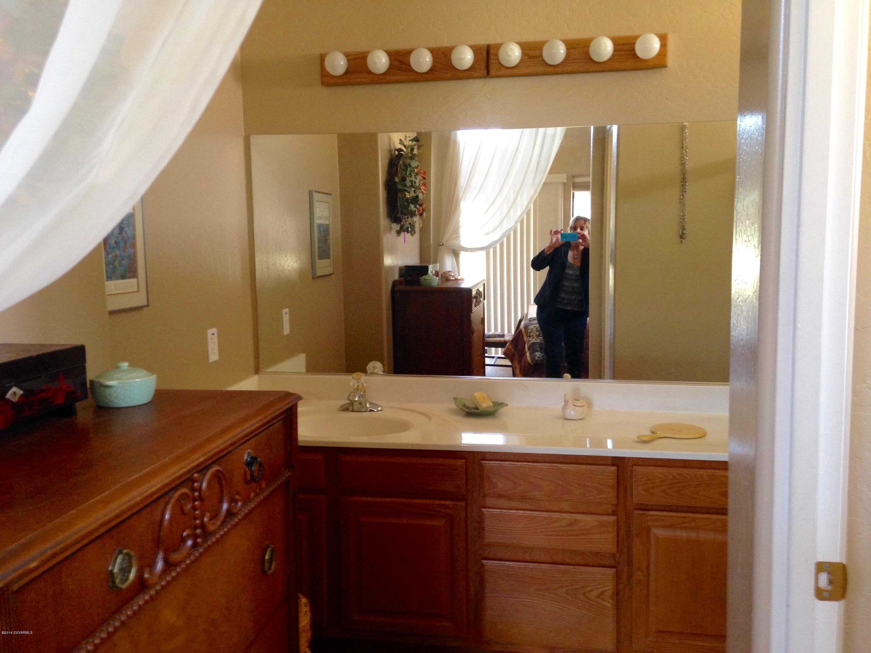 3749 East Beaver Vista Road Rimrock, AZ 86335 - Photo 26 of 26 a bathroom with a sink and a mirror