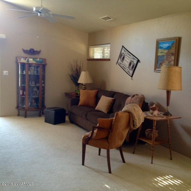 3749 East Beaver Vista Road Rimrock, AZ 86335 - Photo 8 of 26 a living room with furniture a lamp and a rug