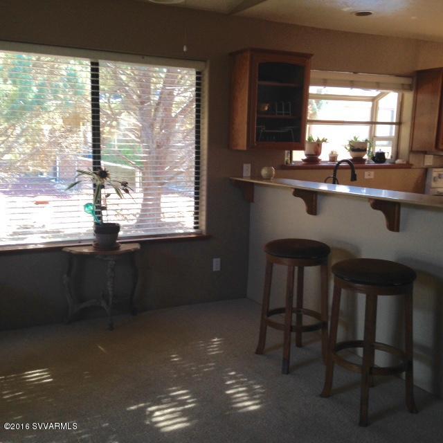 3749 East Beaver Vista Road Rimrock, AZ 86335 - Photo 10 of 26 a kitchen with a sink window and cabinets
