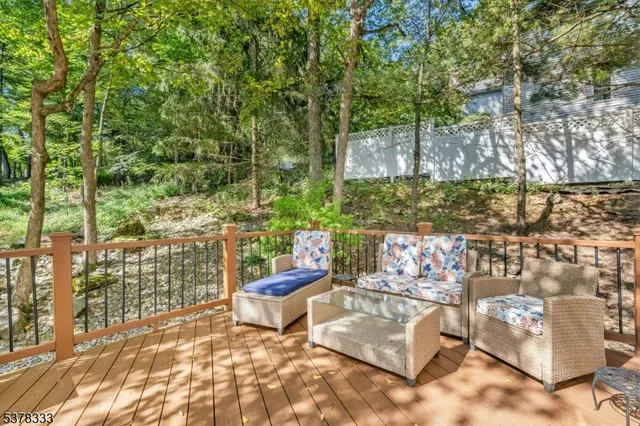 a view of a chairs and table in backyard