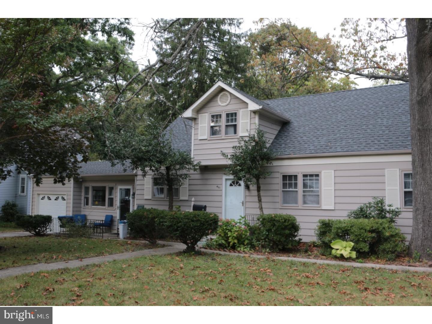 401 Swarthmore Road Glassboro, NJ 08028 - Photo 1 of 20 a front view of a house with a yard and garage