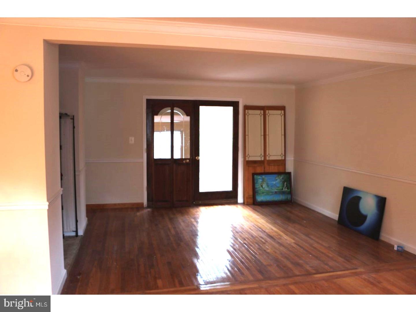 401 Swarthmore Road Glassboro, NJ 08028 - Photo 11 of 20 a view of an empty room with wooden floor and a window