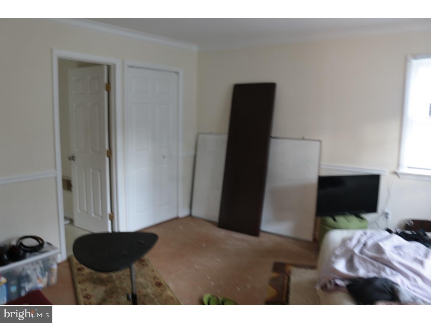 401 Swarthmore Road Glassboro, NJ 08028 - Photo 14 of 20 a bedroom with a bed and a chair