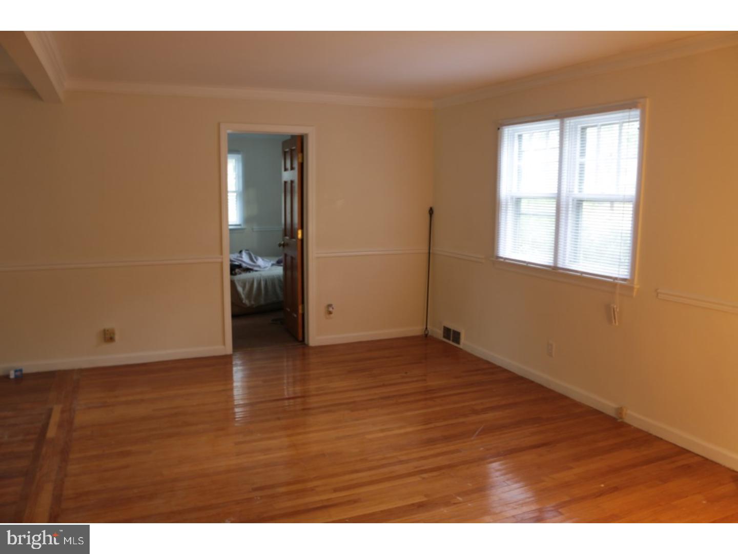 401 Swarthmore Road Glassboro, NJ 08028 - Photo 10 of 20 an empty room with wooden floor and windows