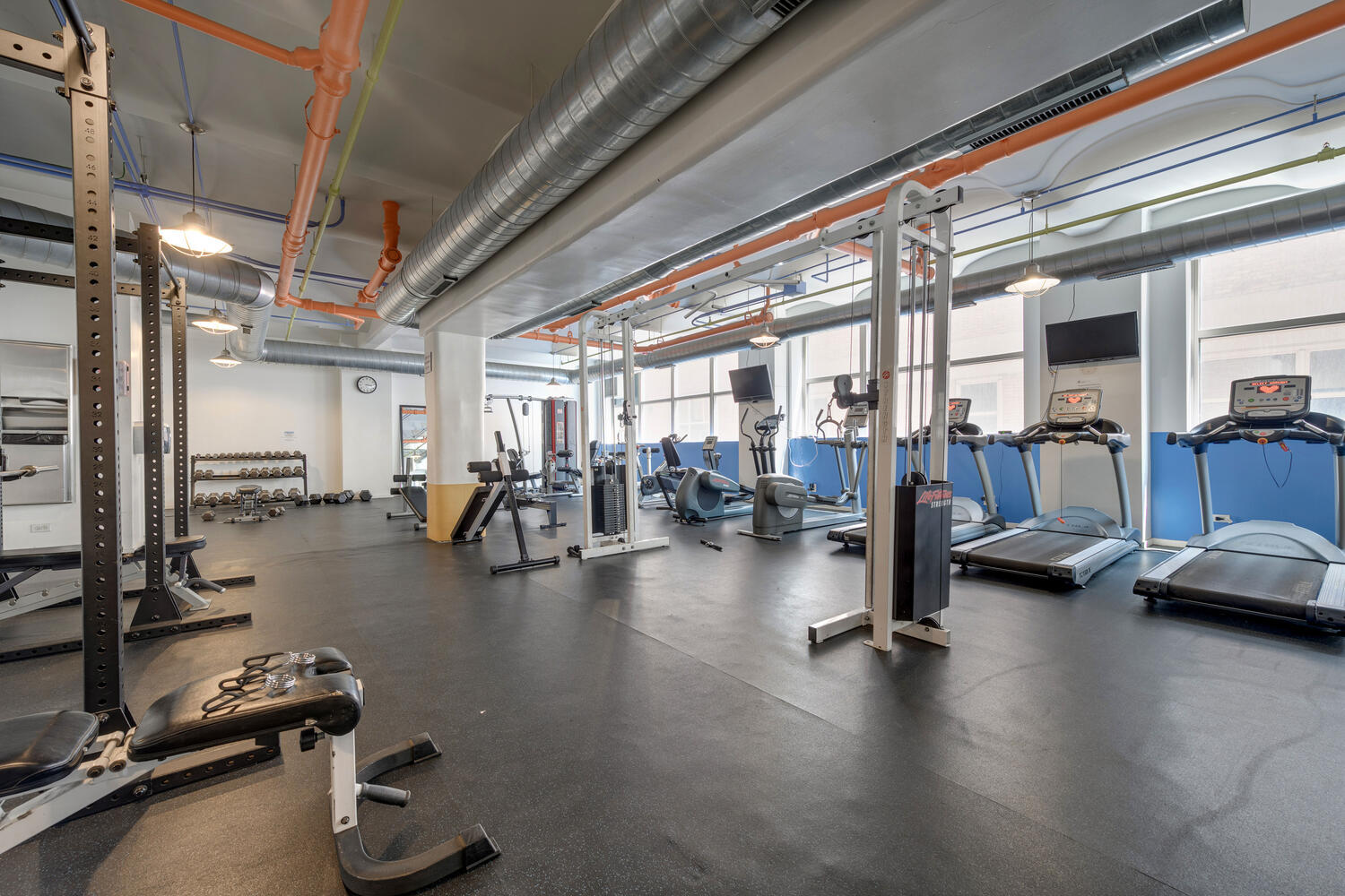 500 South Clinton Street, Unit 841 Chicago, IL 60607 - Photo 22 of 22 a gym room with gym equipment and a large window