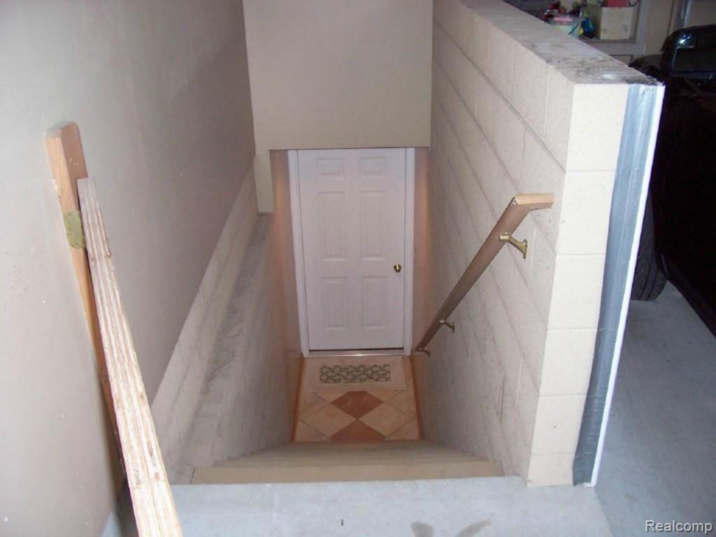 14470 Hough Road Allenton, MI 48002 - Photo 31 of 39 stairs from garage to basement