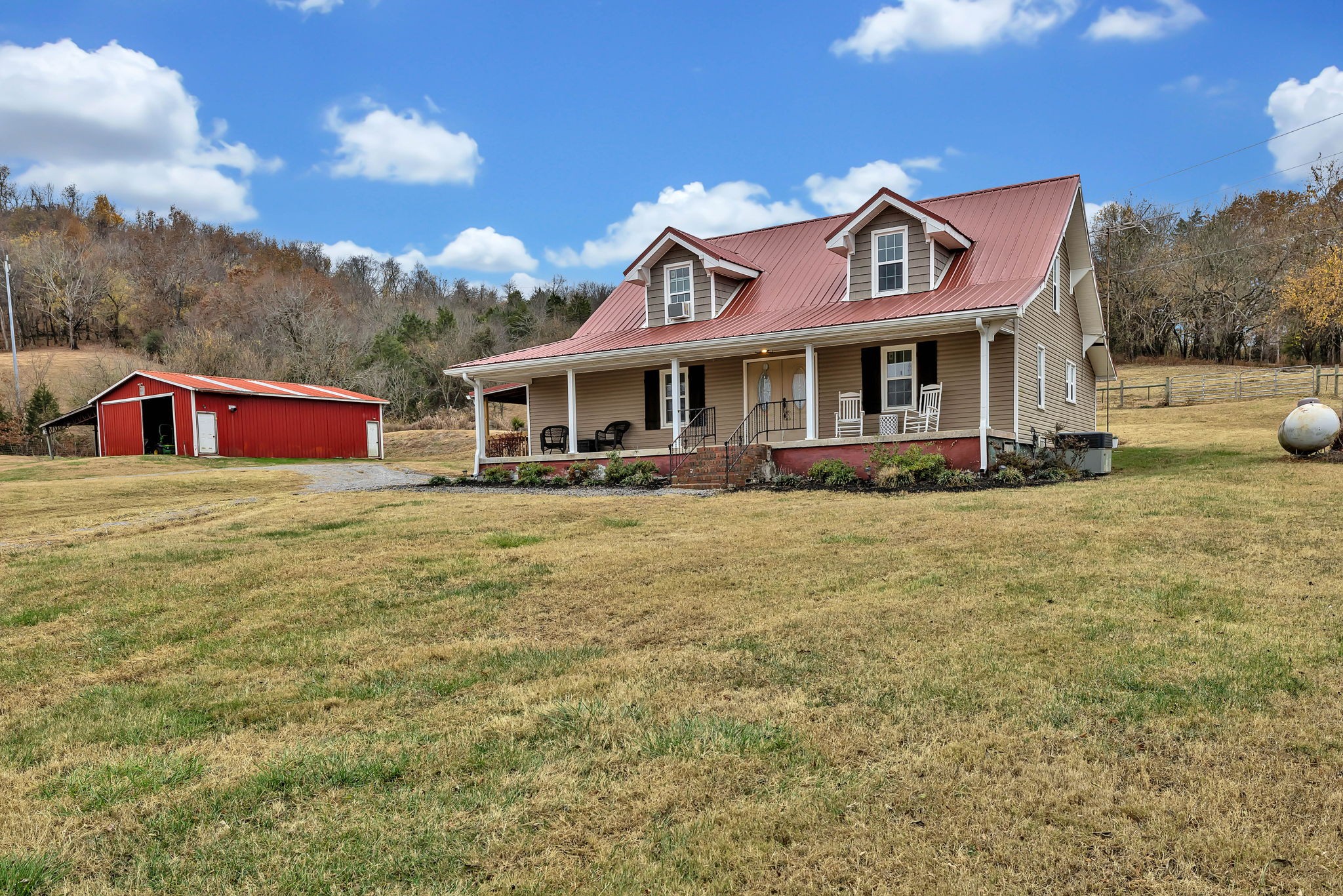 a front view of house with yard and seating space