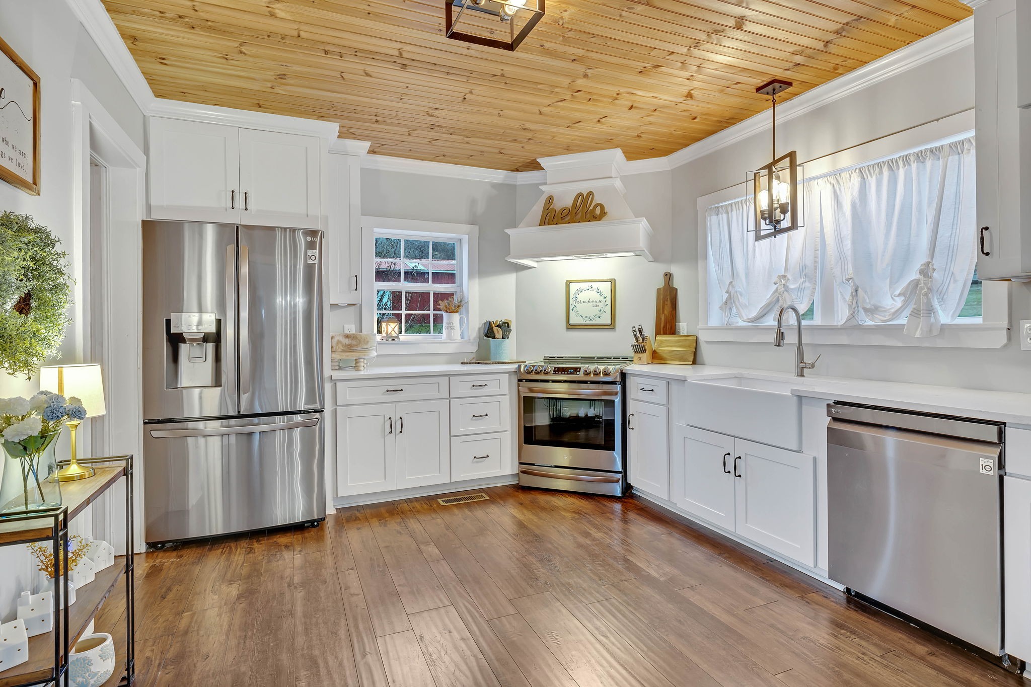 3132 Fishing Ford Road Petersburg, TN 37144 - Photo 12 of 36 a kitchen with granite countertop white cabinets and stainless steel appliances