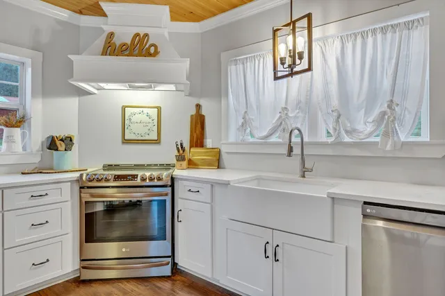 a kitchen with a stove and a sink