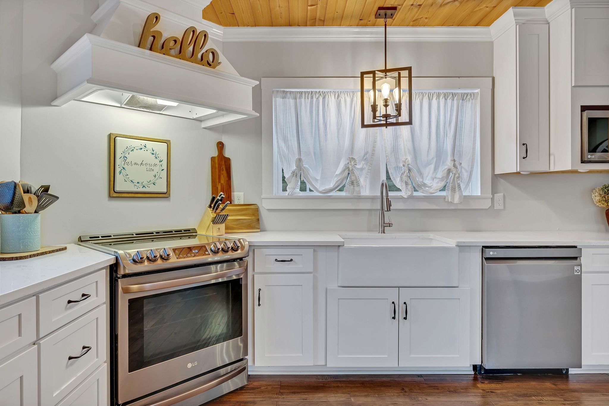 3132 Fishing Ford Road Petersburg, TN 37144 - Photo 16 of 36 a kitchen with stainless steel appliances white cabinets and a wooden floor