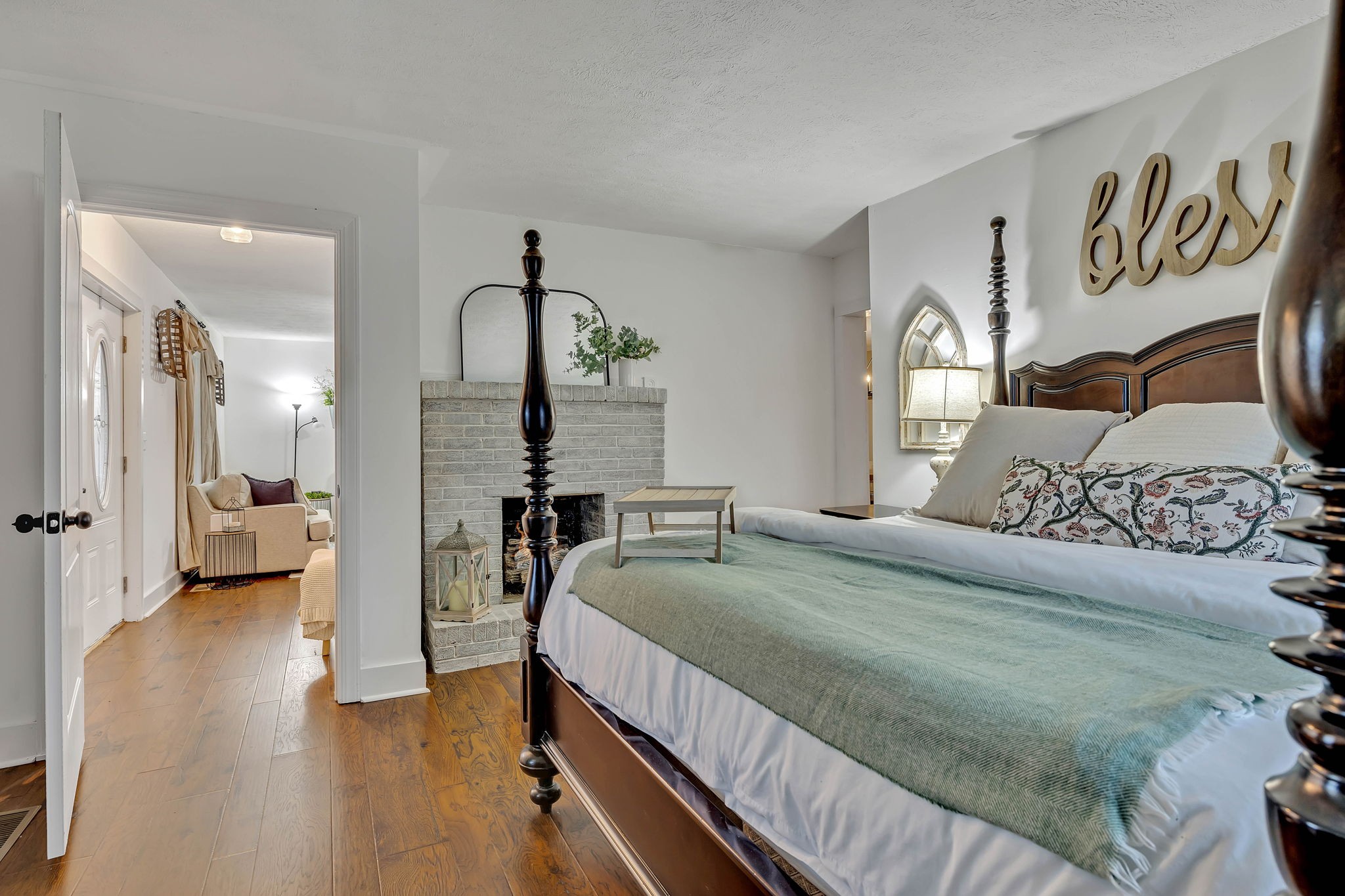 3132 Fishing Ford Road Petersburg, TN 37144 - Photo 23 of 36 a bedroom with a large bed and a wooden floor