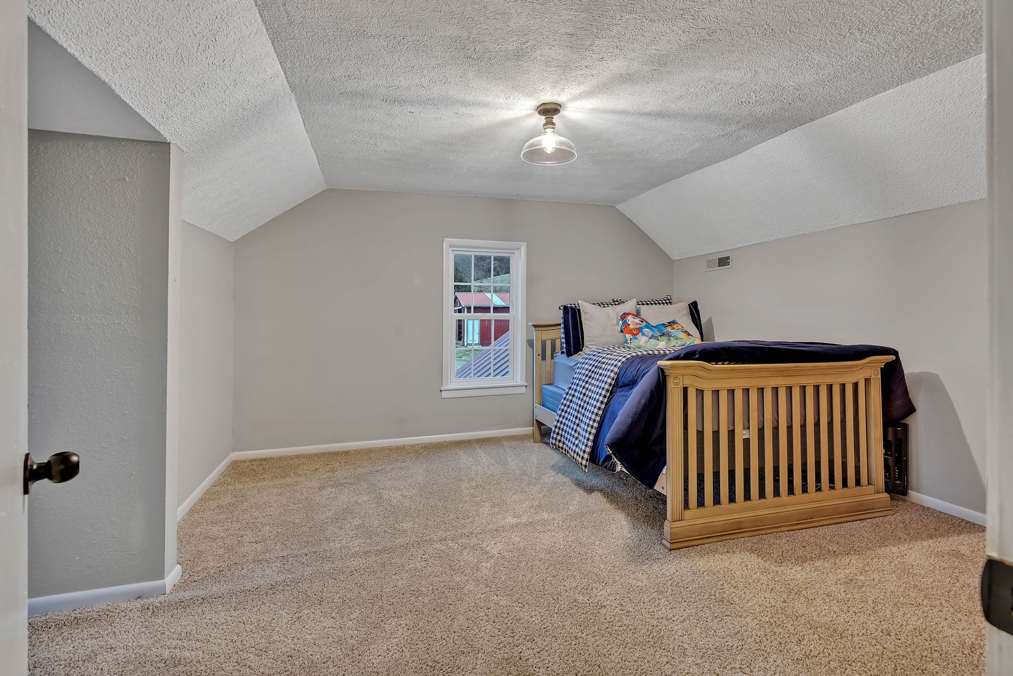 3132 Fishing Ford Road Petersburg, TN 37144 - Photo 28 of 36 a bedroom with a bed and a chandelier