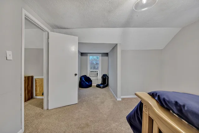 a view of room with furniture and closet