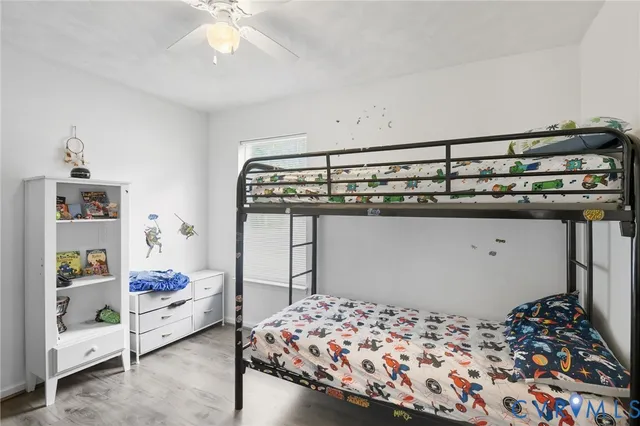 a bedroom with bed and walk in closet