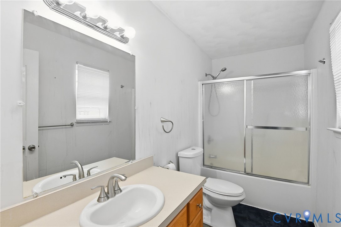 117 Pleasant Spring Avenue Waverly, VA 23890 - Photo 13 of 17 a bathroom with a sink toilet and shower