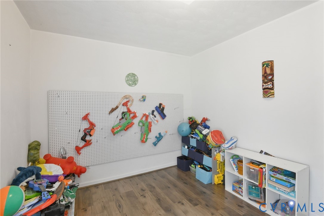 117 Pleasant Spring Avenue Waverly, VA 23890 - Photo 16 of 17 a room with toys and wooden play wall