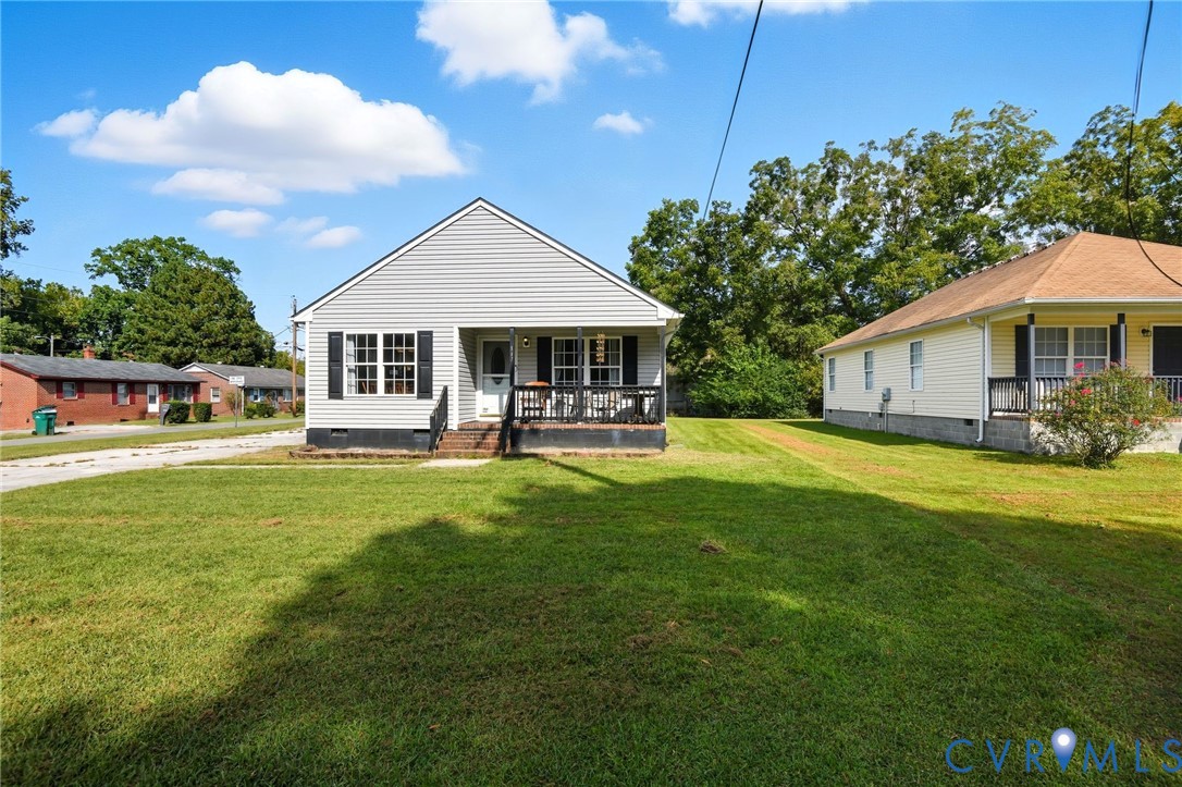 117 Pleasant Spring Avenue Waverly, VA 23890 - Photo 2 of 17 a front view of a house with garden
