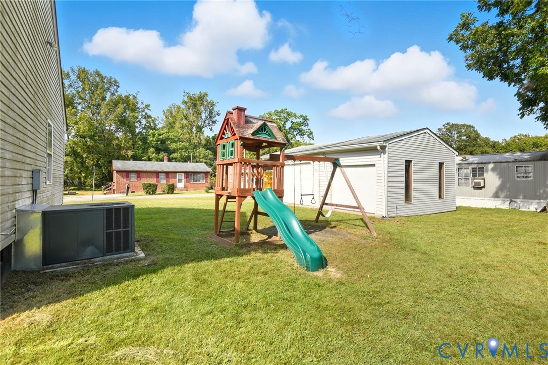 117 Pleasant Spring Avenue Waverly, VA 23890 - Photo 4 of 17 a house view with a garden space
