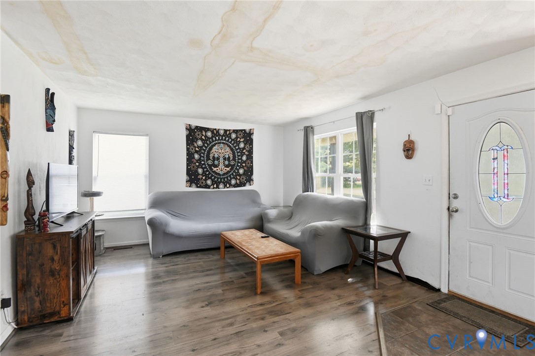 117 Pleasant Spring Avenue Waverly, VA 23890 - Photo 5 of 17 a living room with furniture and a window