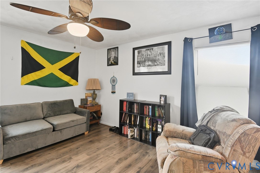 117 Pleasant Spring Avenue Waverly, VA 23890 - Photo 6 of 17 a living room with furniture and a wooden floor
