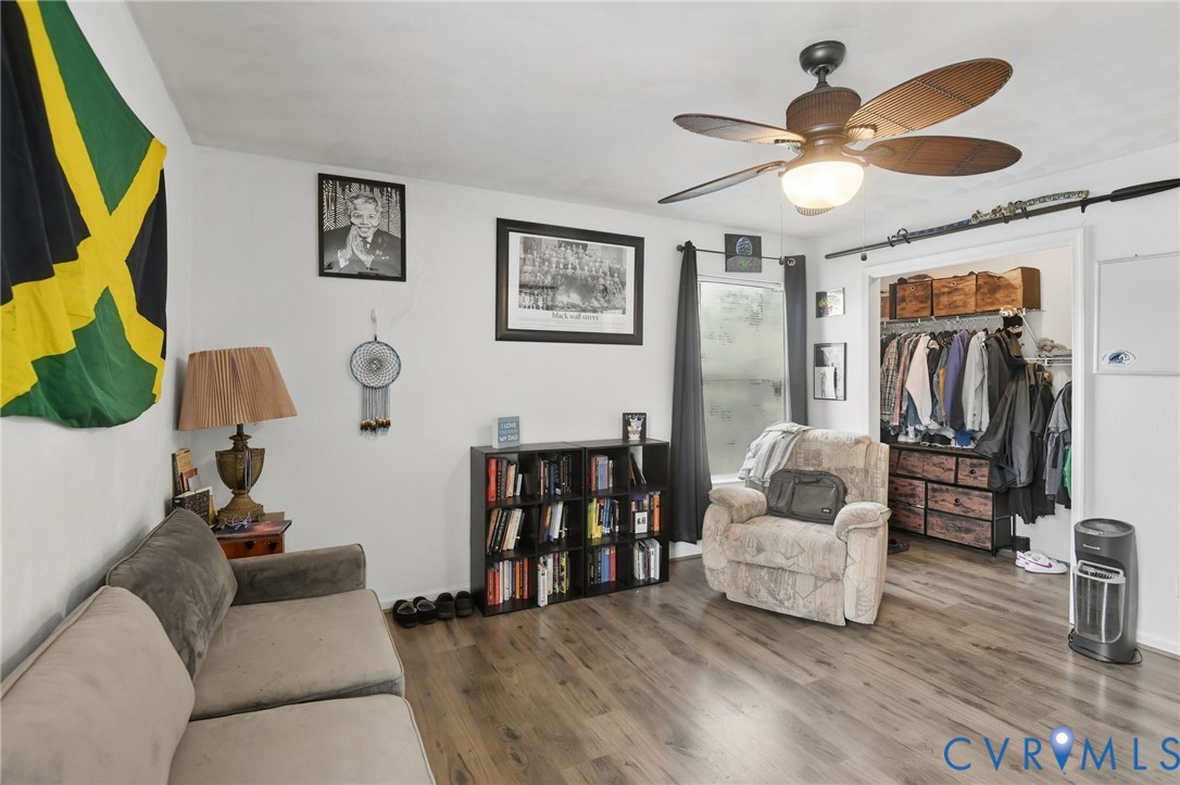 117 Pleasant Spring Avenue Waverly, VA 23890 - Photo 7 of 17 a living room with furniture and a chandelier