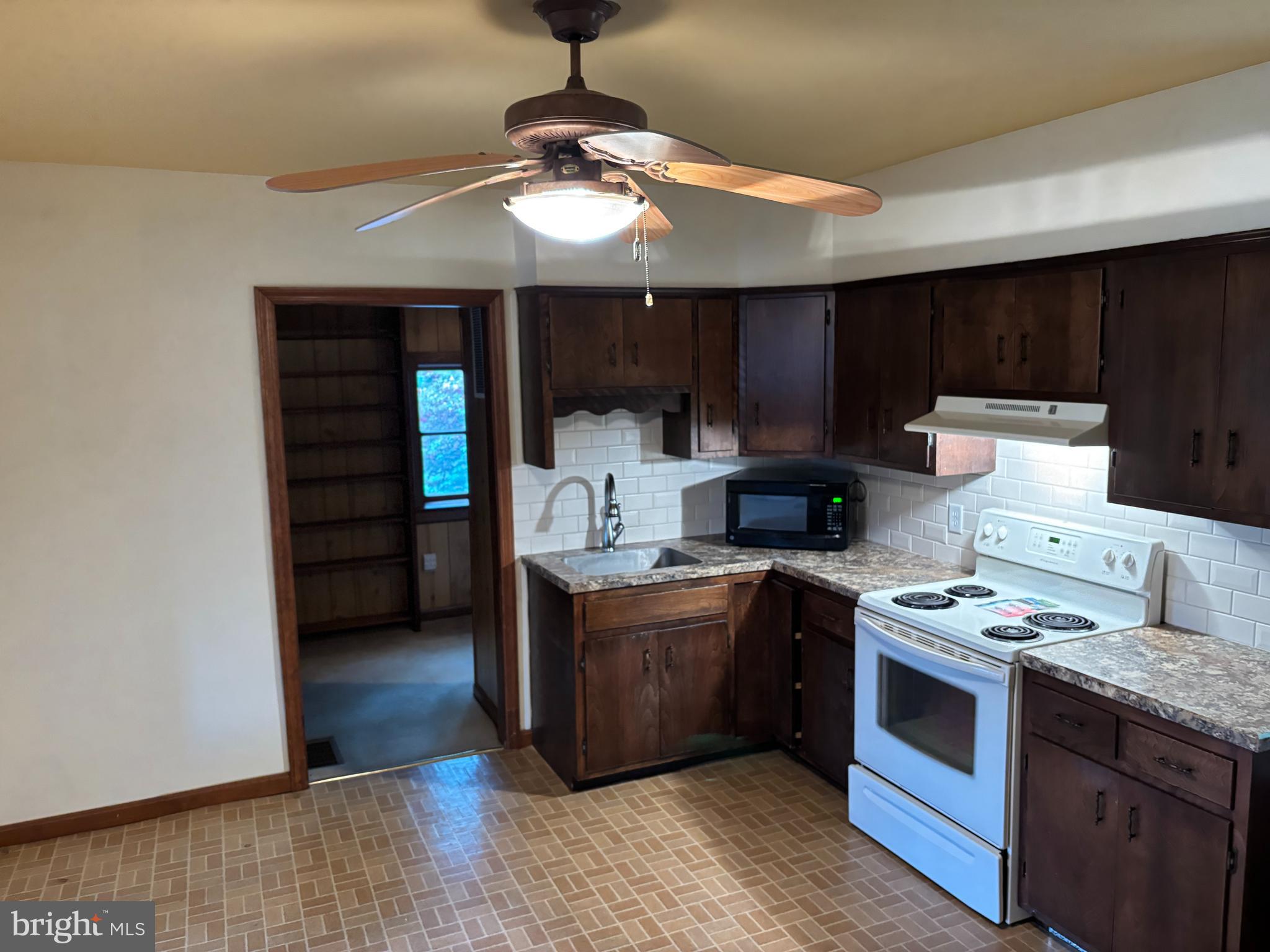 385 Kendig Road Conestoga, PA 17516 - Photo 27 of 101 a kitchen with stainless steel appliances granite countertop a stove and a refrigerator