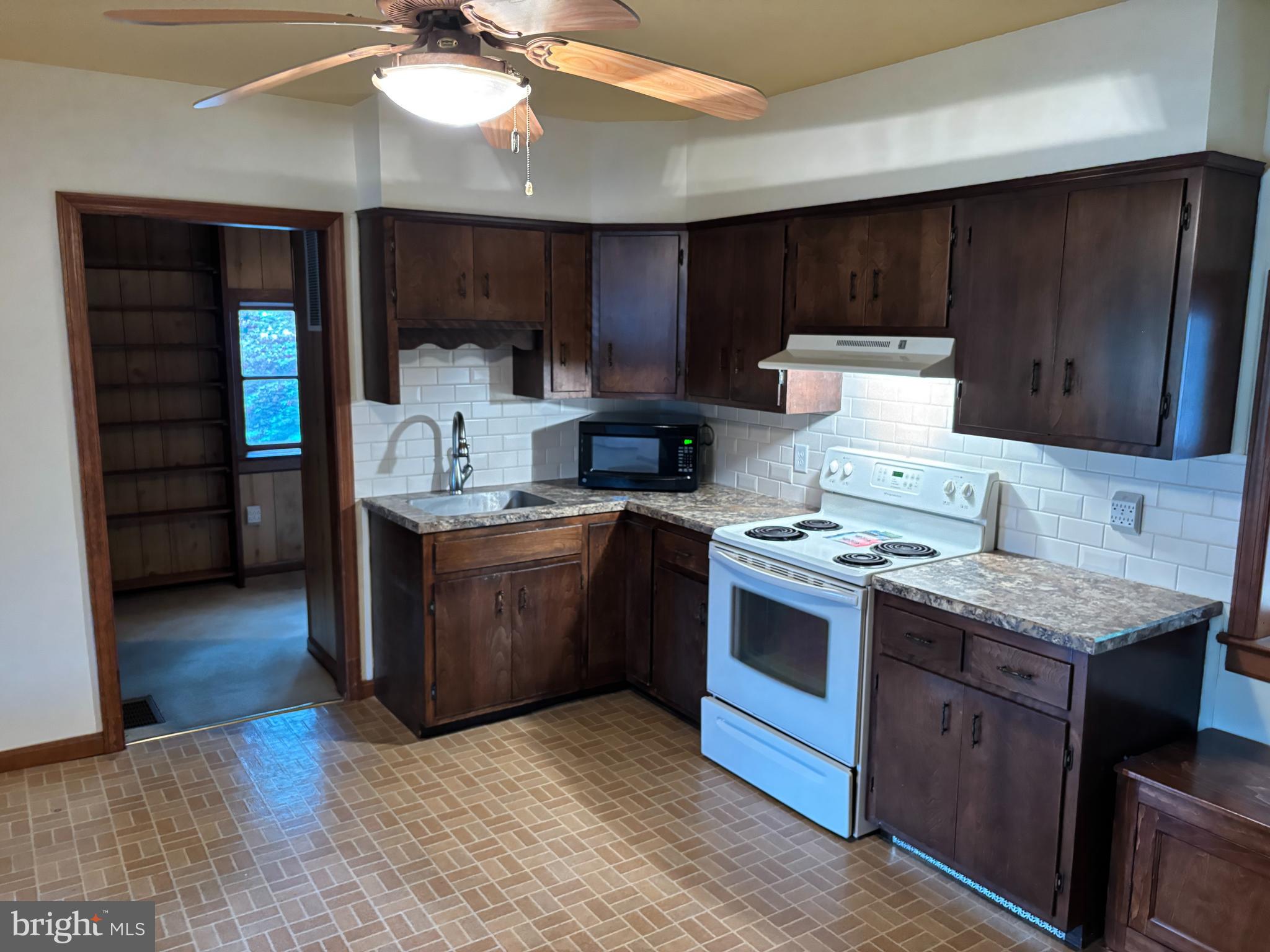 385 Kendig Road Conestoga, PA 17516 - Photo 31 of 101 a kitchen with stainless steel appliances granite countertop a stove and a refrigerator