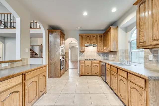 a large kitchen with cabinets