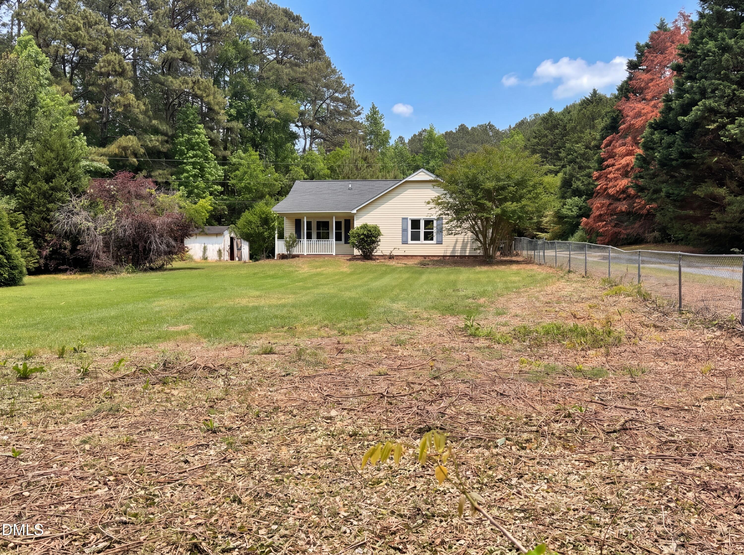 4894 Elevation Road, Unit C Benson, NC 27504 - Photo 2 of 24 a view of a house with a yard