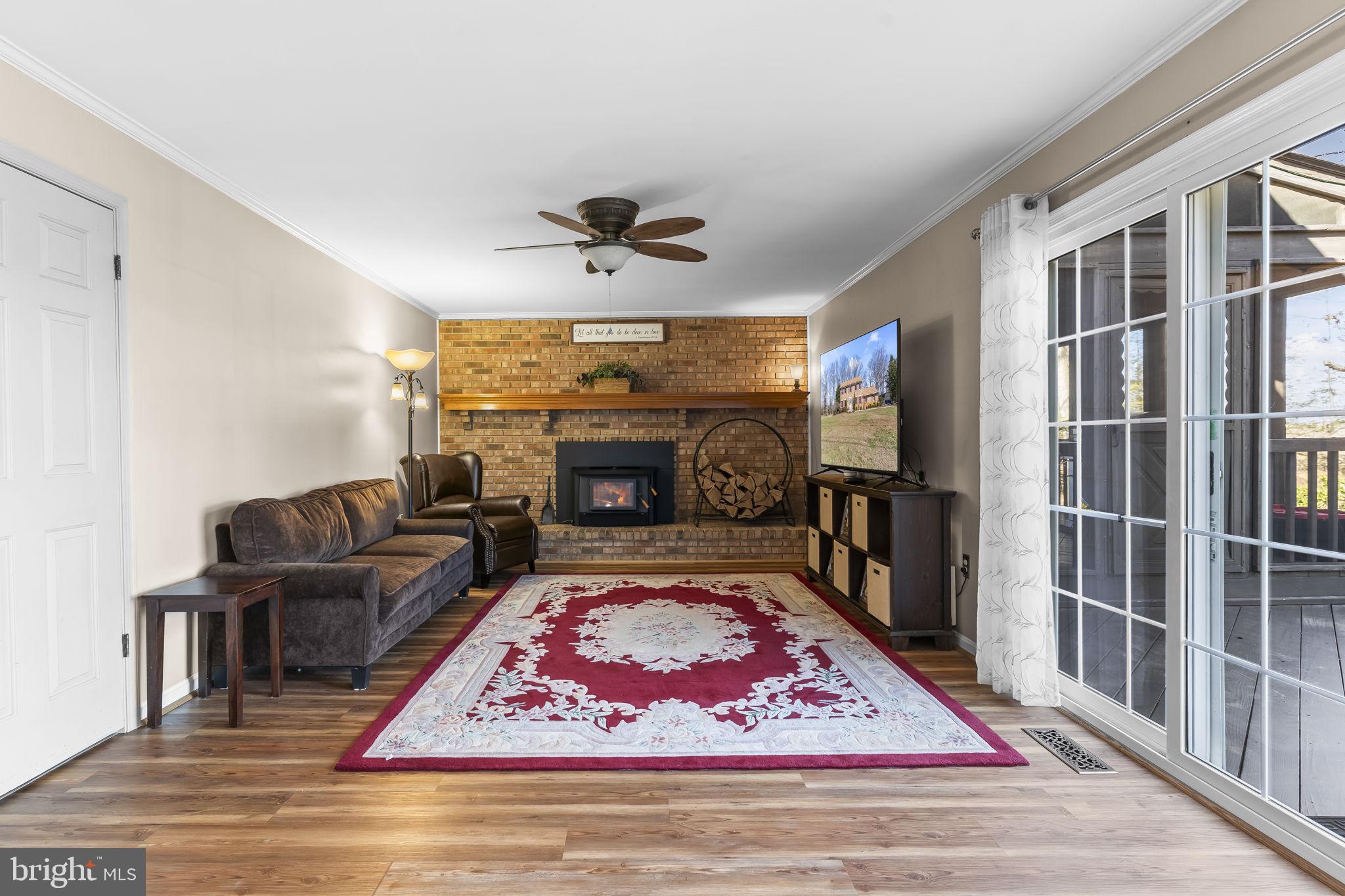 11460 La Plata Road La Plata, MD 20646 - Photo 11 of 51 a living room with furniture rug and a fireplace