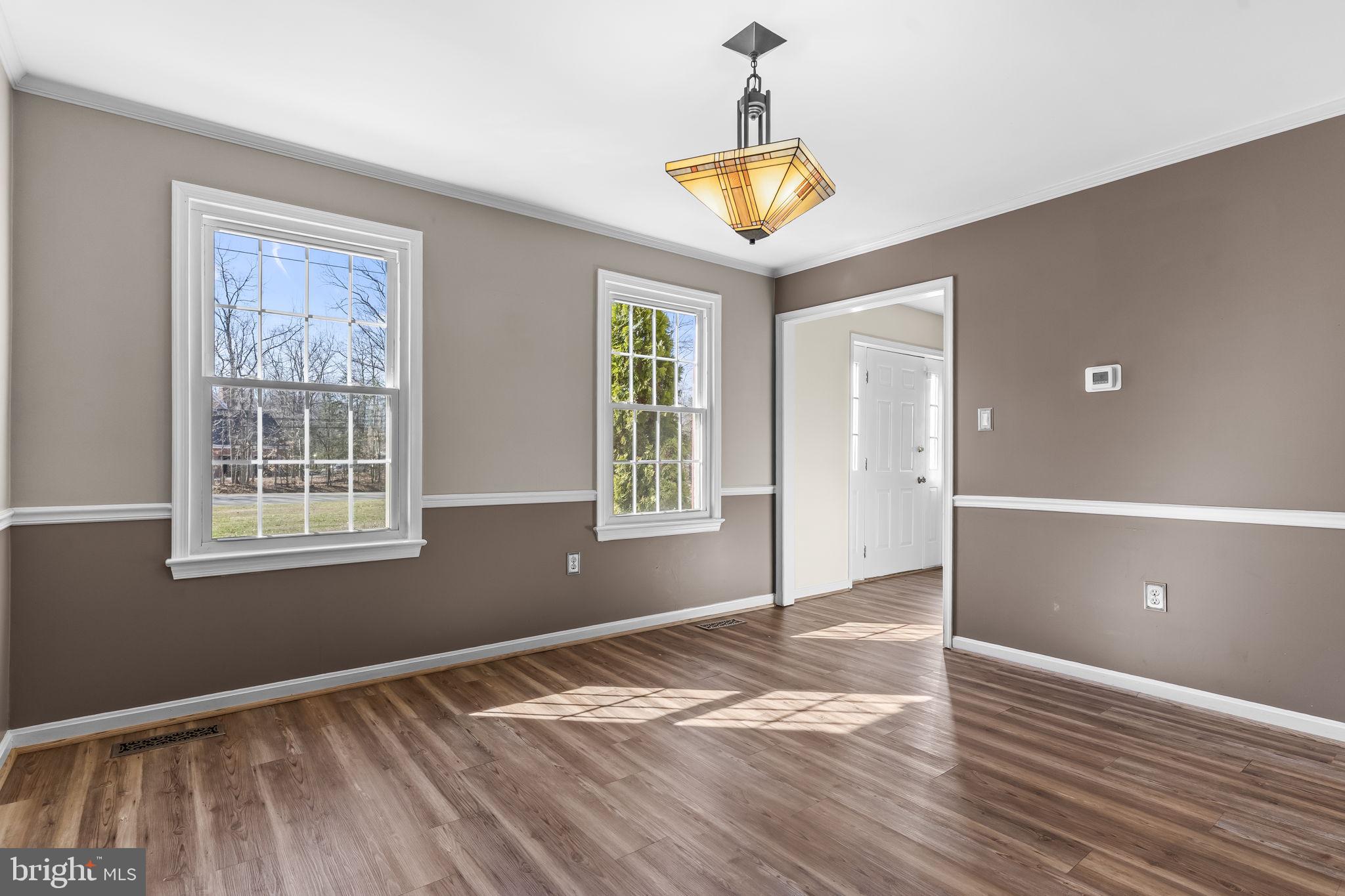 11460 La Plata Road La Plata, MD 20646 - Photo 13 of 51 a view of an empty room with window and wooden floor