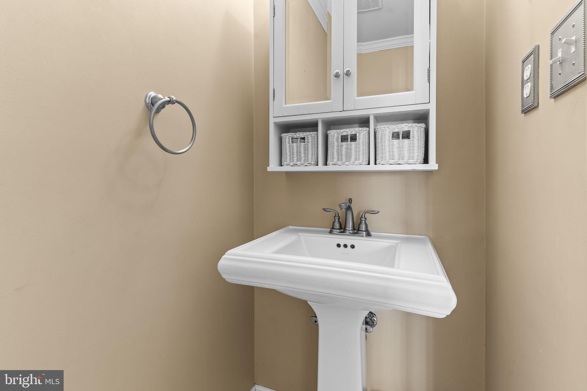 11460 La Plata Road La Plata, MD 20646 - Photo 16 of 51 a bathroom with a sink and a mirror