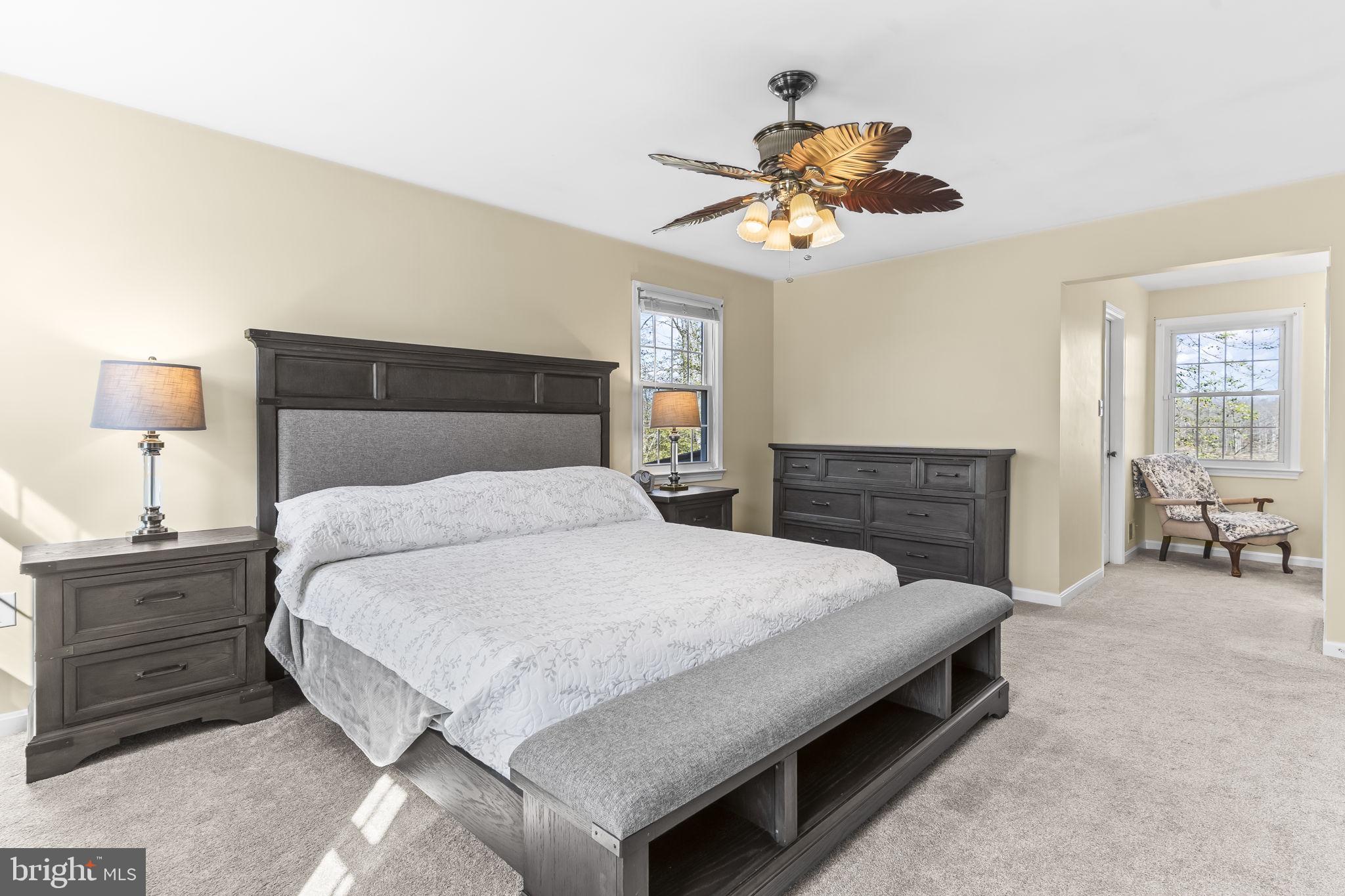 11460 La Plata Road La Plata, MD 20646 - Photo 20 of 51 a bedroom with a bed and a chandelier