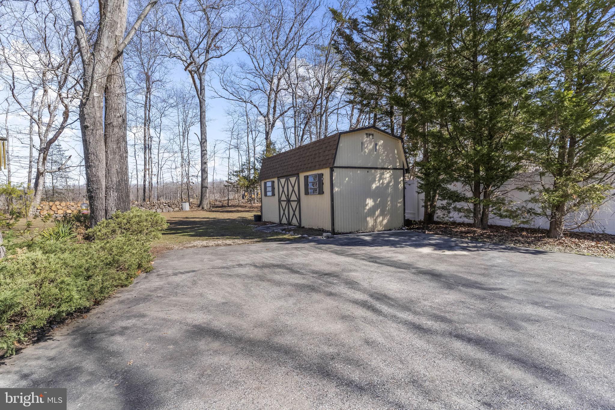 11460 La Plata Road La Plata, MD 20646 - Photo 48 of 51 a view of a house with a yard and large tree