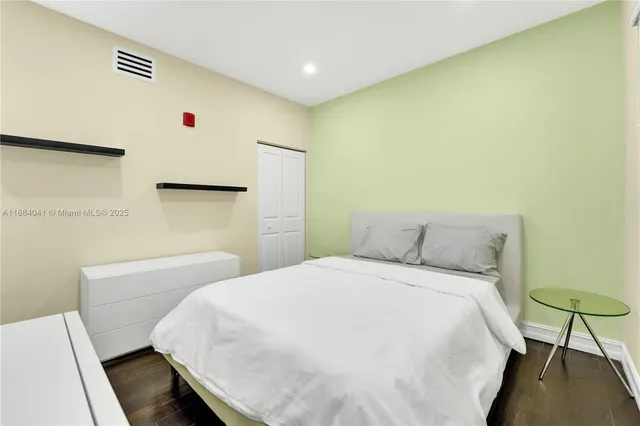 a bedroom with a bed and a table in it