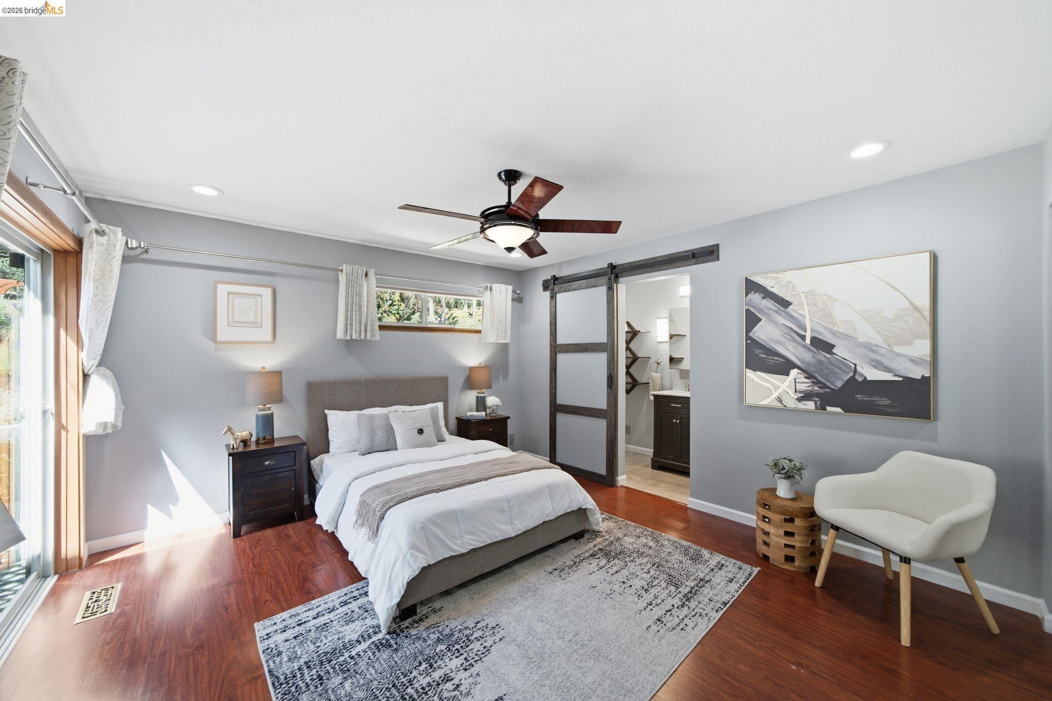 11133 Golf Links Road Oakland, CA 94605 - Photo 38 of 57 Bedroom featuring rich wood-finish flooring, light gray wall paint, and recessed lighting